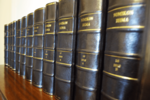 A range of law books aligned on a shelf.